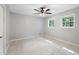 Sun-filled bedroom showcasing bright, natural light from two large windows at 1125 Murray Sw Cir, Marietta, GA 30064