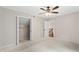 Neutral bedroom featuring a ceiling fan, closet, and view of the staircase at 1125 Murray Sw Cir, Marietta, GA 30064