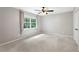 Neutral bedroom with carpet flooring and a large window at 1125 Murray Sw Cir, Marietta, GA 30064