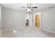 Cozy bedroom featuring a ceiling fan, closet and view of the staircase at 1125 Murray Sw Cir, Marietta, GA 30064