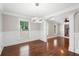 Open concept dining room showcasing modern lighting fixture and hardwood floors at 1125 Murray Sw Cir, Marietta, GA 30064