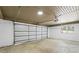 Interior garage view with concrete floor, overhead lighting, and a window at 1125 Murray Sw Cir, Marietta, GA 30064
