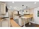 Well-lit kitchen featuring a large island, modern cabinets, and granite countertops at 1125 Murray Sw Cir, Marietta, GA 30064