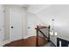 Upstairs landing features hardwood floors, white doors and black hardware at 1125 Murray Sw Cir, Marietta, GA 30064