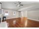 Spacious living room featuring hardwood floors, neutral paint, lots of natural light, and a ceiling fan at 1125 Murray Sw Cir, Marietta, GA 30064