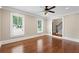 Bright living room featuring hardwood floors, large windows, and crown molding at 1125 Murray Sw Cir, Marietta, GA 30064