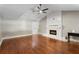 Living room with hardwood floors, fireplace with white mantel and trim and ceiling fan at 1125 Murray Sw Cir, Marietta, GA 30064