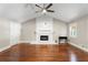 Bright living room featuring a vaulted ceiling, modern fireplace, and hardwood floors at 1125 Murray Sw Cir, Marietta, GA 30064