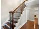 Staircase with hardwood steps and wrought iron railings at 1125 Murray Sw Cir, Marietta, GA 30064