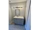 A modern bathroom featuring patterned floors and a gray vanity at 3575 Oakvale Rd # 1103, Decatur, GA 30034