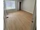 Bright bedroom featuring sleek laminate floors and a window letting in natural light at 3575 Oakvale Rd # 1103, Decatur, GA 30034