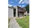 Exterior of building with a brown balcony, sliding glass doors and grassy lawn at 3575 Oakvale Rd # 1103, Decatur, GA 30034