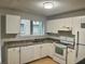 Bright kitchen with white cabinetry, granite countertops, and stainless-steel appliances at 3575 Oakvale Rd # 1103, Decatur, GA 30034