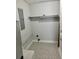 Bright utility room featuring patterned flooring and a convenient shelf at 3575 Oakvale Rd # 1103, Decatur, GA 30034