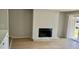 Spacious living room with a fireplace, patio door, and modern laminate floors at 3575 Oakvale Rd # 1103, Decatur, GA 30034