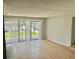 A well-lit living room with large windows and sliding glass doors at 3575 Oakvale Rd # 1103, Decatur, GA 30034