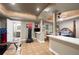 Basement room with exercise equipment, a bed, and an ensuite bathroom at 417 Rhodes House Dr, Suwanee, GA 30024