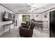 Finished basement featuring tiled floor, bar area and media entertainment zone at 417 Rhodes House Dr, Suwanee, GA 30024