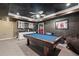 Finished basement with a pool table, wet bar, and stylish dark ceiling at 417 Rhodes House Dr, Suwanee, GA 30024