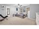 Neutral bedroom with natural light, ceiling fan and modern decor at 417 Rhodes House Dr, Suwanee, GA 30024