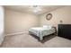Bright bedroom with ceiling fan, light color walls and carpeted floors at 417 Rhodes House Dr, Suwanee, GA 30024