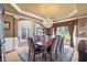 Formal dining room featuring hardwood floors, a decorative chandelier, and ample seating space at 417 Rhodes House Dr, Suwanee, GA 30024
