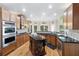 Gourmet kitchen with custom cabinets, granite countertops, and modern appliances at 417 Rhodes House Dr, Suwanee, GA 30024