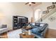 Spacious living room with vaulted ceilings, hardwood floors, and a comfortable seating area at 417 Rhodes House Dr, Suwanee, GA 30024