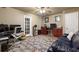 Spacious office with ample desk space, a comfortable couch, and neutral tones at 417 Rhodes House Dr, Suwanee, GA 30024