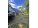 Exterior view of the home with a wooden deck and fenced-in backyard, offering privacy and outdoor enjoyment at 5028 Highway 81, Mcdonough, GA 30252