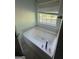 Bathroom featuring a bathtub and a window with natural light at 5028 Highway 81, Mcdonough, GA 30252
