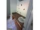 Bathroom with vanity and sink, tiled floor, and good lighting at 5028 Highway 81, Mcdonough, GA 30252