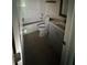 Modest bathroom featuring a tub and shower combo, toilet, single vanity, and neutral tile flooring at 5028 Highway 81, Mcdonough, GA 30252