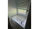 Bathtub is positioned under a window at 5028 Highway 81, Mcdonough, GA 30252