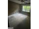 Spacious bedroom with a large window allowing plenty of natural light at 5028 Highway 81, Mcdonough, GA 30252