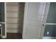 View of closet with ample storage shelving and white door at 5028 Highway 81, Mcdonough, GA 30252
