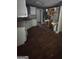 Bright kitchen with wooden floor, sink, and white cabinetry for storage at 5028 Highway 81, Mcdonough, GA 30252