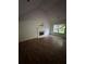 Spacious living room with hardwood floors, fireplace, and large window providing natural light at 5028 Highway 81, Mcdonough, GA 30252