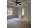 Spacious main bedroom features a ceiling fan, coffered ceiling, and an ensuite bathroom at 5028 Highway 81, Mcdonough, GA 30252