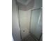 Enclosed shower features tiled walls and a clear glass door at 5028 Highway 81, Mcdonough, GA 30252