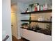 Elegant bar area with stylish storage, shelving, glassware and bar accessories for entertaining guests at 1350 May Avenue # 14, Atlanta, GA 30316