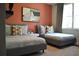 This bedroom features twin beds, colorful pillows and art for a modern, comfortable design at 1350 May Avenue # 14, Atlanta, GA 30316