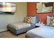 Twin beds, colorful pillows, TV, and modern decor provide a functional and appealing bedroom space at 1350 May Avenue # 14, Atlanta, GA 30316