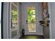 Bright entryway with hardwood floors, decorative accents, and a glass paneled door allowing natural light to fill the space at 1350 May Avenue # 14, Atlanta, GA 30316