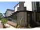 Modern townhouse exterior with brick and siding, featuring a sidewalk and street view at 1350 May Avenue # 14, Atlanta, GA 30316
