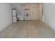 Spacious two car garage interior with white walls, concrete flooring, and storage cabinets at 1350 May Avenue # 14, Atlanta, GA 30316