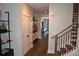 Spacious hallway with hardwood floors, stairway, and ample storage space leading to other areas of the home at 1350 May Avenue # 14, Atlanta, GA 30316