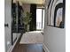 Hallway with modern decor and sleek hardwood floors, leading to a bright living space at 1350 May Avenue # 14, Atlanta, GA 30316