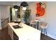 Bright kitchen island with seating, undermount sink, modern faucet, and stylish decor, perfect for casual dining at 1350 May Avenue # 14, Atlanta, GA 30316