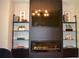 A beautifully decorated living room with a sleek fireplace and display shelves at 1350 May Avenue # 14, Atlanta, GA 30316